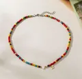 Detailed view of colorful beaded necklace with white heart and gold initial Z charm - Letter Z