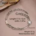 Macro detail of stainless steel heart zircon and pearl bracelet showing exact measurements - Silver