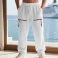 Gros plan du pantalon en lin blanc avec fermetures éclair décoratives et cordon. - Blanc
