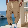 Close-up detail of men's fleece-lined cargo pants featuring drawstring waist and pockets - Camel