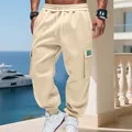 Detail view of men's heavy fleece cargo sweatpants with drawstring waist and pockets - Apricot