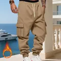 Close-up detail of khaki heavyweight fleece cargo pants for men with multi-pockets - Camel