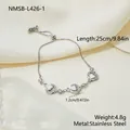 Detailed macro view of heart-shaped mother-of-pearl and zircon stainless steel bracelet - Silver Heart Style (NMSB-L426-1) / 18K Gold