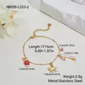 Detailed view of gold plated stainless steel bracelet with floral and leaf charms - Bracelet (NMSB-L323-2) / 18K Gold