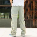 Herren Loose-Fit Jeans in heller Waschung mit ausgefransten Patchwork-Details und Rissen - 34 / Unterteile / Nostalgie Blau