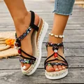 Stylish bohemian wedge sandals featuring floral braided straps and colorful bead accents - Black with Embroidery