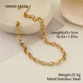 Detailed view of the textured gold stainless steel embossed chain necklace with specs - 43+5cm