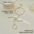 Detailed view of gold hand chain bracelet with heart crystal showing all product measurements - Heart Zirconia Ring-Linked Bracelet (NMSR-M344-3)