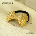 Detailed macro view of the gold bow-shaped metal hair tie showing 5.3cm size and weight - Gold Curved Bow Style (NMSH-E528-2)