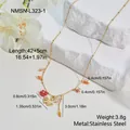 Detailed view of stainless steel necklace with ginkgo leaf and red flower beads - Necklace (NMSN-L323-1) / 18K Gold