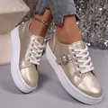 Stylish gold metallic platform sneakers with crystal buckle and white laces. - 36 / Gold