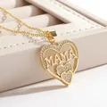 Macro detail of an 18k gold plated heart pendant featuring MAMA lettering and zircon inlay - Gold O-Chain / Gold