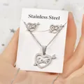 Silver stainless steel jewelry set featuring heart love pendant necklace and earrings. - Cupid's Arrow Love Heart Style (TT-197)