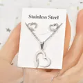 Silver stainless steel jewelry set with heart-shaped necklace and matching stud earrings - Geometric Lines Hollow Heart Style (TT-199)