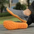 Gray breathable knit men's hiking shoe featuring a non-slip orange rubber tread sole - Dark Gray