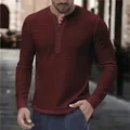 Close-up view of a men's striped Henley shirt showing multi-button collar detail. - S / Tops / Burgundy