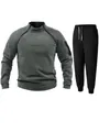 Detail view of men's fleece tracksuit with unique chest zippers and black joggers. - M / Top And Bottom / Gray