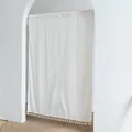 White fabric door curtain with yellow dot pattern and tassels hanging in an archway - Daisy Single Opening / 85x90cm / Off White