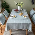 Detailed lifestyle view of a gray-blue tablecloth with 3D stitching and tassel trim - 100*140cm / Blue