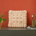 Plush cream biscuit shaped chair cushion displayed in a modern home interior setting - Square Biscuit Shape / Beige