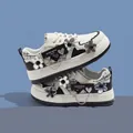 Trendy white and black girls' platform sneakers featuring cute flower charm accents - 29 / Black