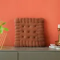 Detailed view of a soft brown biscuit-shaped plush cushion resting on a stylish sideboard - Square Biscuit Shape / Brown