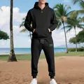 Men's black heavy fleece tracksuit set featuring a half-zip hoodie and jogger pants on a beach - S / Top And Bottom / Black