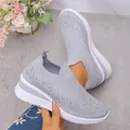 Women's grey fly-knit slip-on sneakers featuring sparkling rhinestone accents and wedge sole - 36 / Light Gray