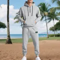 Full-length view of a men's heavy gray hoodie and sweatpants set on a beach - S / Top And Bottom / Light Gray
