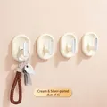 Set of 4 minimalist cream and silver-plated adhesive wall hooks for home storage - Set of 4 / Milk Yellow
