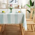 Close-up detail of striped light blue cotton linen tablecloth with elegant white tassels - 100*140cm / Blue
