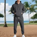 Detailed shot of grey fleece-lined tracksuit set on model in outdoor beach setting - Dark Gray