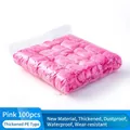Pack of 100 pink disposable PE plastic shoe covers for indoor floor protection - 100 Pieces Pack / Pink