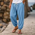 Detail shot of men's light blue cotton linen joggers with white drawstring and cuffed hem. - Sky Blue