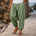 Loose men's sage green cotton linen joggers with elastic drawstring waist and cuffed ankles. - S / Bottoms / Light Green