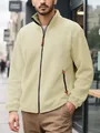 Detail view of a men's cream fleece zip-up hoodie featuring a side vertical pocket design. - S / Tops / Apricot