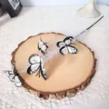 Artificial butterfly branch decoration with white reed and black pattern butterflies - White