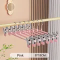 Detail view of pink stainless steel trouser hangers with adjustable non-slip clips - Enhanced Version / Pink