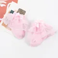 Detail shot of pink baby socks featuring elegant double-layer lace ruffles and bow - One Size (0-1 Year Old) / Pink