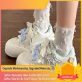 Zapatillas de plataforma crema para niñas con lazo de cuadros azules y detalle de estrella - Azul