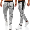 Close-up of grey men's fitness joggers with black drawstring and side pockets - S / Bottoms / Light Gray