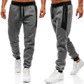 Detail view of men's grey sports joggers with black side panels and zippered pockets - S / Bottoms / Dark Gray