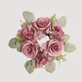 Top-down view of a dusty rose artificial flower wreath with realistic petals and leaves - Rose Red