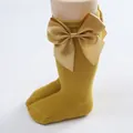 Ginger yellow children's knee-high socks with large satin bow detail - Turmeric