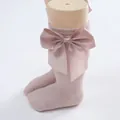 Soft pink baby knee-high socks featuring a large satin bow for stylish toddler comfort - Lotus root pink