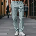 Detail view of men's slim-fit business trousers with drawstring waist and center crease - Haze Blue
