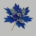Macro view of blue artificial Christmas flower with silver glitter edges and sequins - Blue