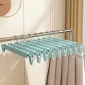 Cintre à pantalons en plastique bleu mat avec clips, largeur 29 cm, sans couture - Style à Crochet Rond Dépoli / Bleu