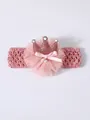 Close-up detail of a pink baby crown headband featuring a lace flower and pearl - Pink