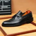 Classic black leather men's tassel loafers with brogue detailing for business formal wear - Black